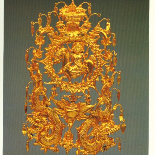 An Ornate headdress element wihich was craftted from a thin sheet of gold using the repousse tehnique